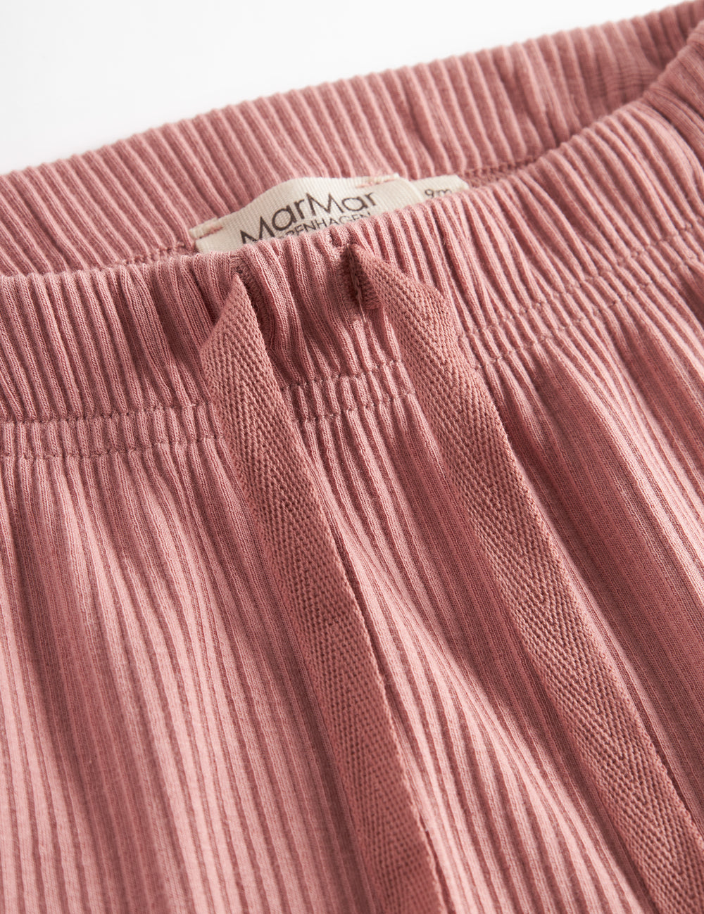 Lyserøde ribstrikkede bukser med snøre i taljen til børn