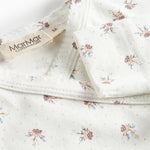 Langærmet bodystocking til nyfødte med slå-om-lukning og blomstermønster