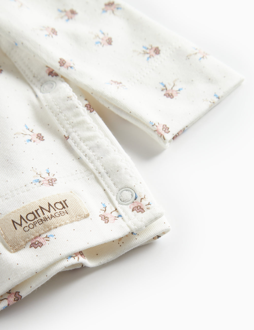 Long-sleeved blouse for newborns with wrap-around closure and floral pattern