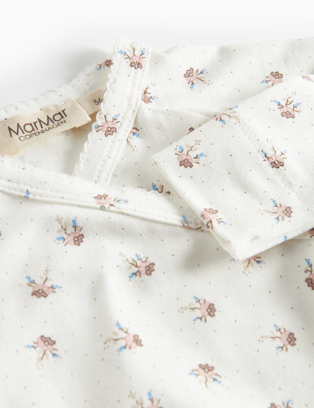 Baby jumpsuit with floral pattern