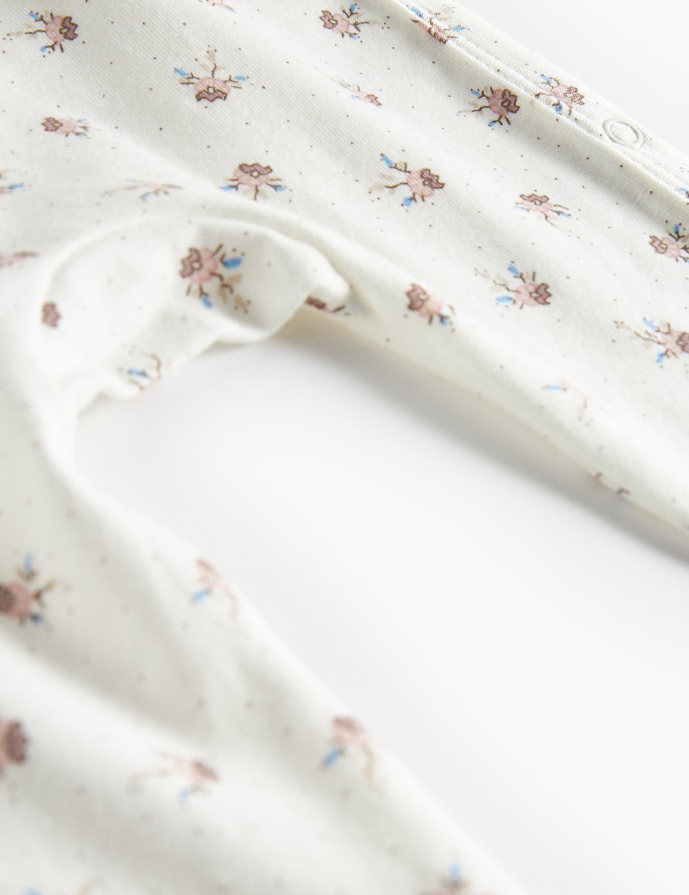 Baby jumpsuit with floral pattern