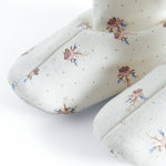 Babyfutter med blomstermønster