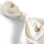 Nærbillede af sløjfe i blødt mønstret stof