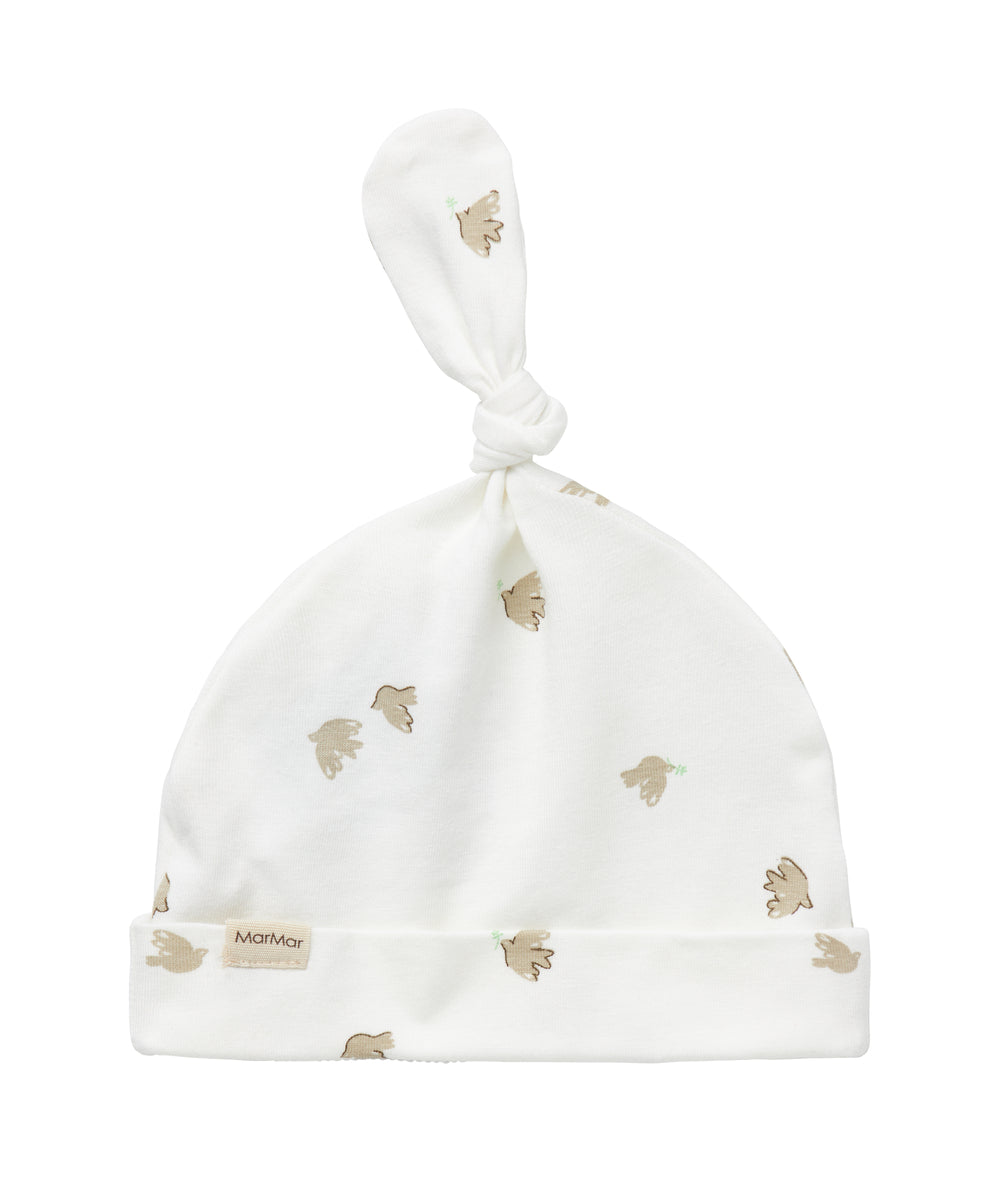 Blød babyhue med mønsterprint og knude på toppen