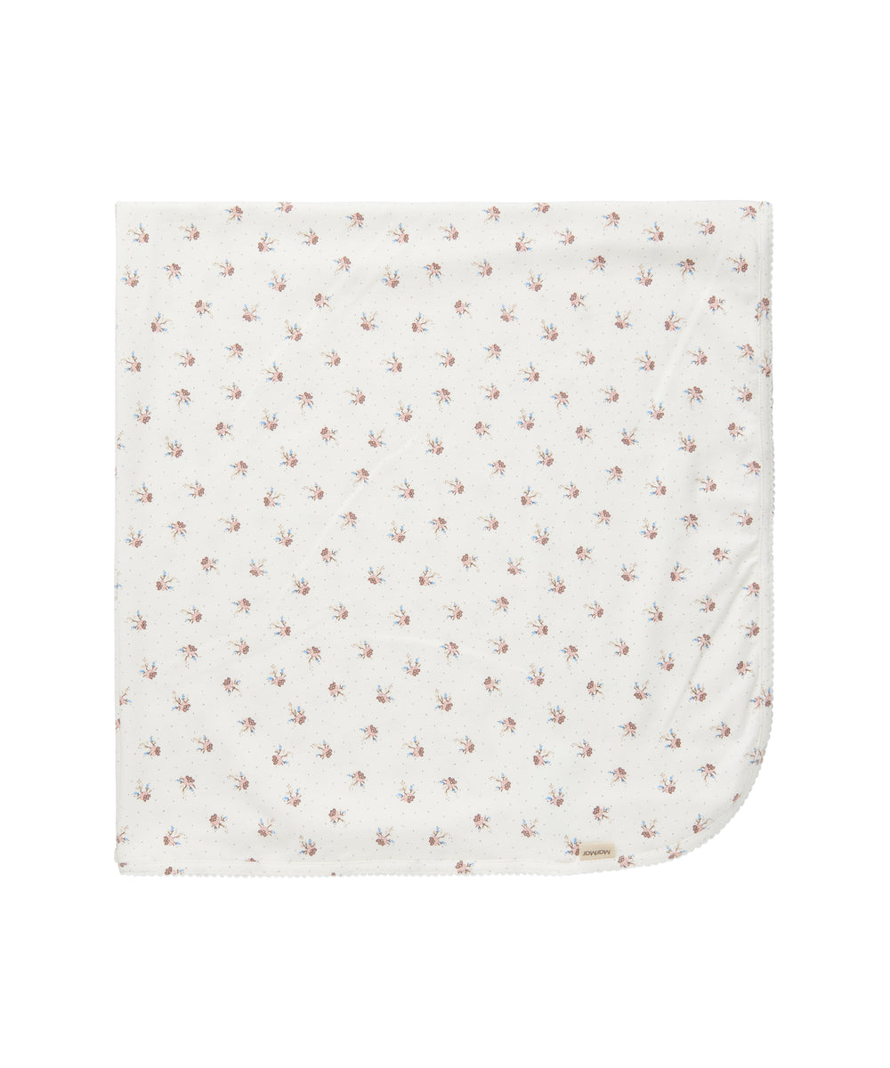 babytæppe med blomstermønster