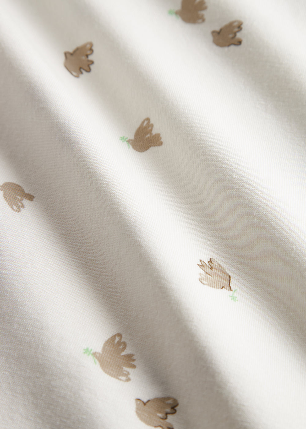 Nærbillede af mønstret stof på tæppe