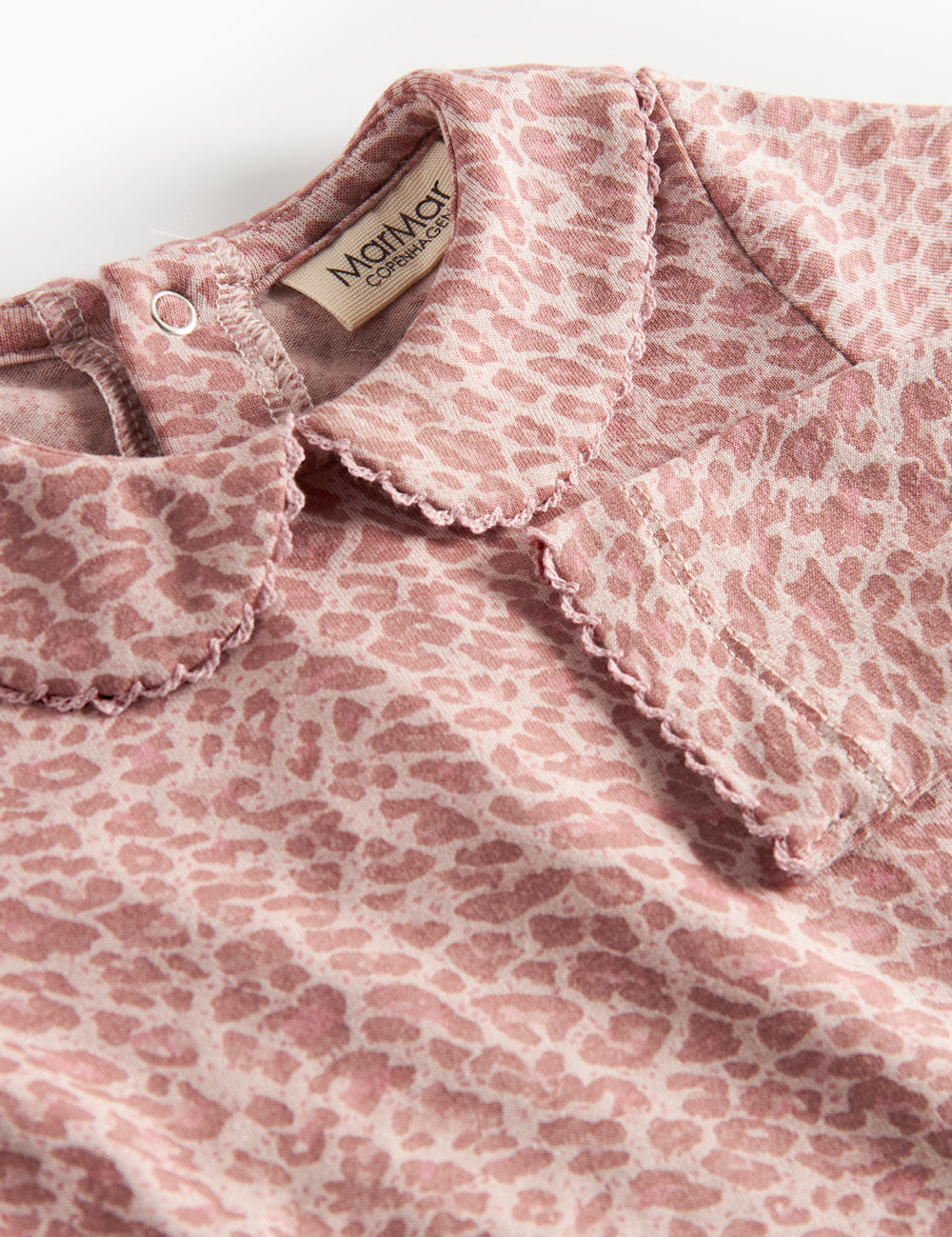 Pink leopard print baby bodysuit with long sleeves and collar