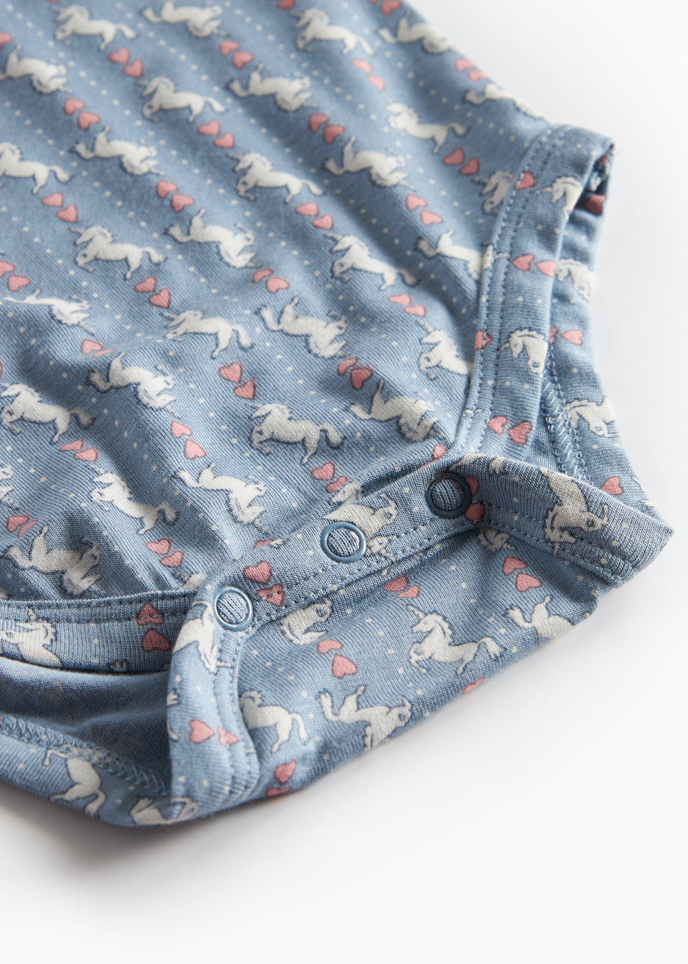 Blå langærmet body til baby med enhjørningemønster og flæsekrave