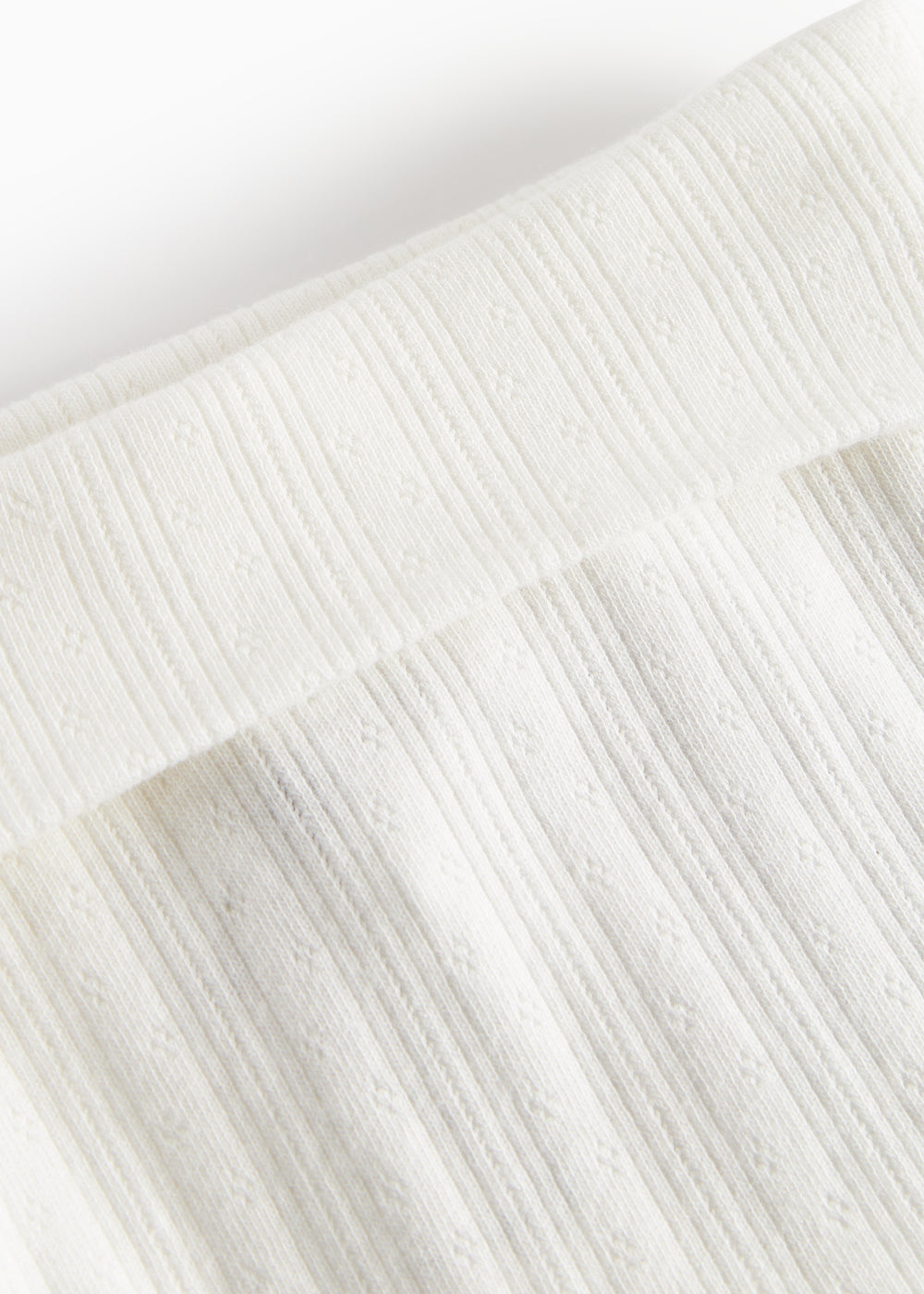 Hvide pointelle bukser med fødder til baby