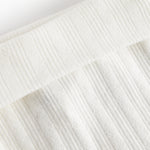 Hvide pointelle bukser med fødder til baby