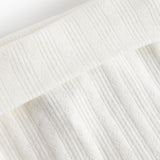 Hvide pointelle bukser med fødder til baby