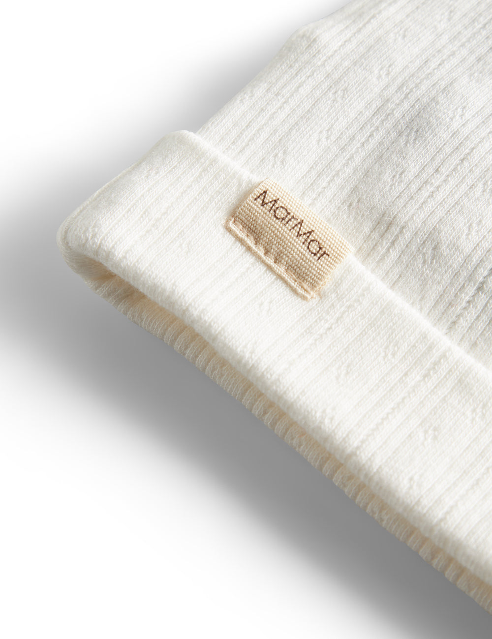 White pointelle hat for baby