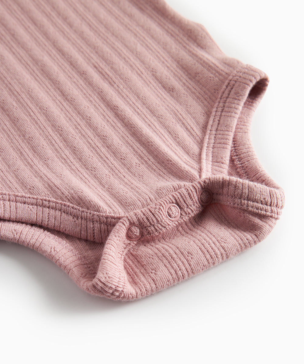 Rosa pointelle body til børn med lange ærmer