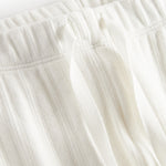 Hvide pointelle bukser til børn med bindebånd og ribkanter