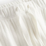 Hvide pointelle bukser til børn med bindebånd og ribkanter