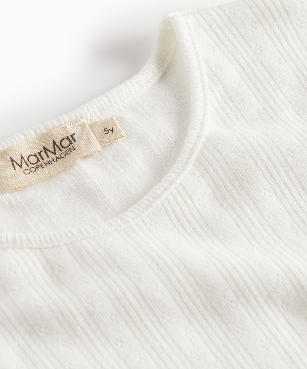 Hvid pointelle bluse til børn med lange ærmer