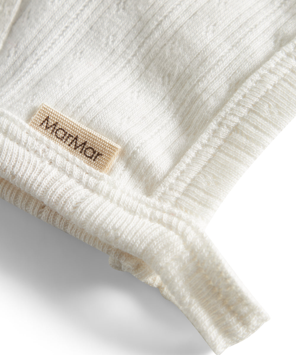 Rosa pointelle hjelm til baby