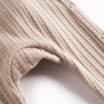 Beige pointelle heldragt med lange ærmer til baby