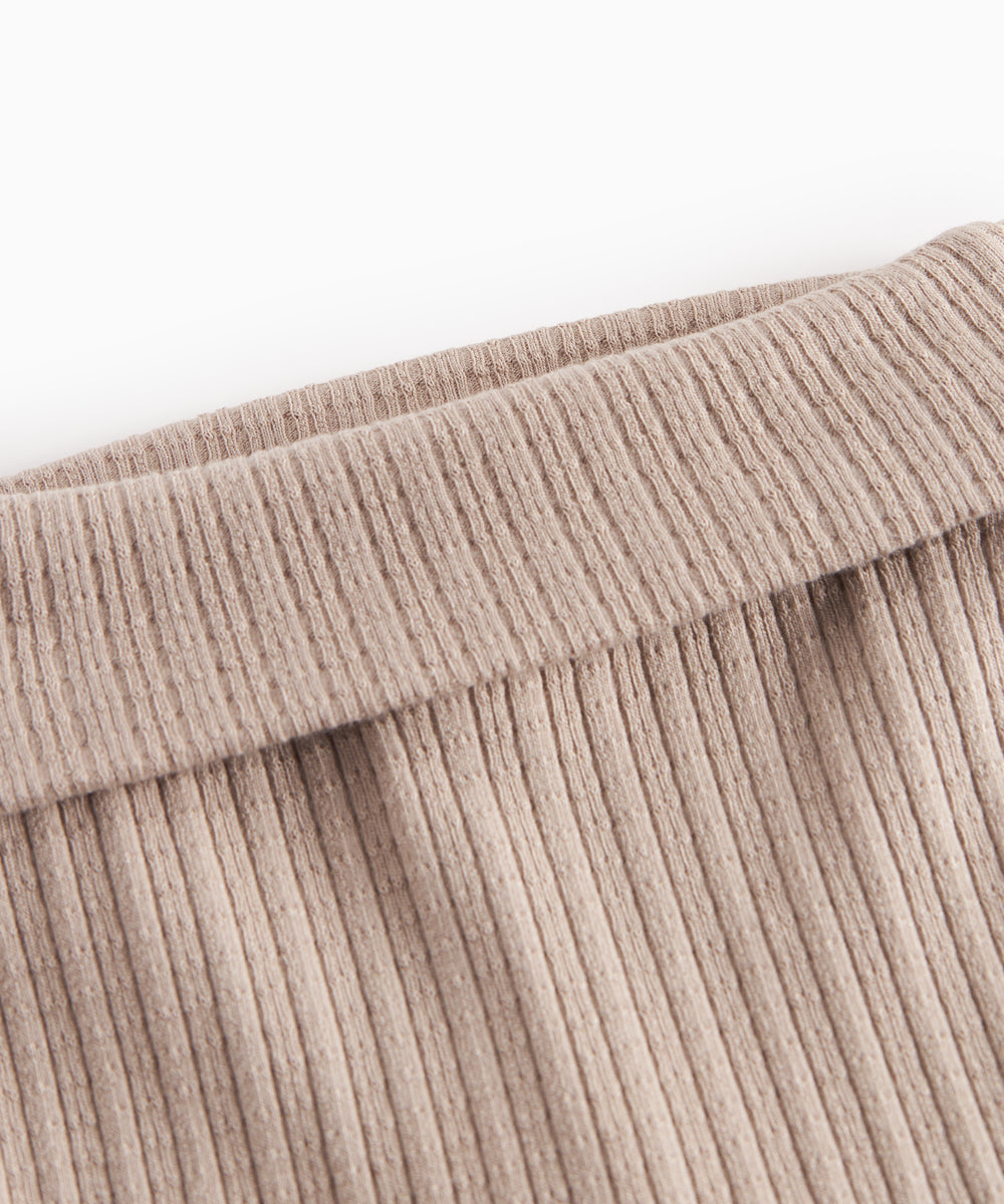 Beige pointelle bukser med fødder til baby