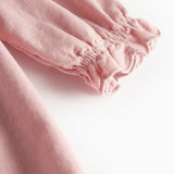 Lyserød babyfløjlskjole med lange ærmer, bølgekant og lommer til børn