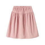 Lyserød nederdel i babyfløjl med knapper og bølgekant til børn