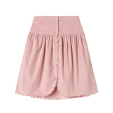 Lyserød nederdel i babyfløjl med knapper og bølgekant til børn