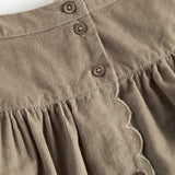 Beige nederdel i babyfløjl med knapper og bølgekant til børn