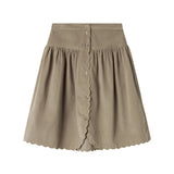 Beige nederdel i babyfløjl med knapper og bølgekant til børn