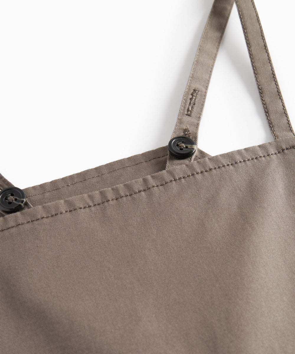 Detaljebillede af strop på kaki selebukser