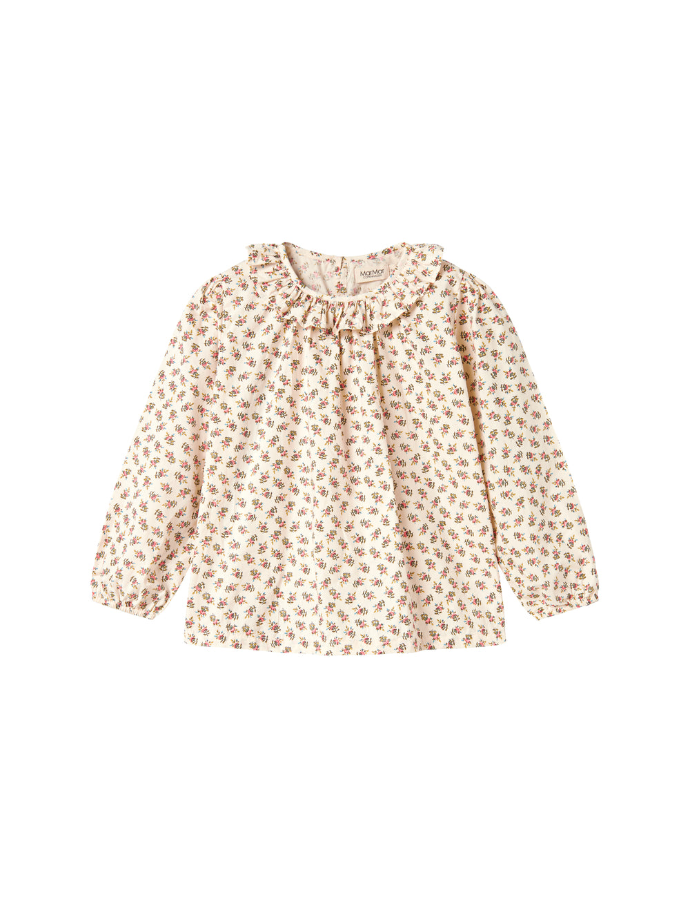 Detaljebillede af bluse med blomstermønster og flæsedetalje