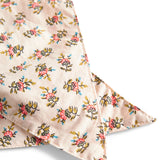 Nærbillede af bindebånd med blomsterprint