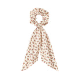 Hårelastik med blomsterprint og bindebånd