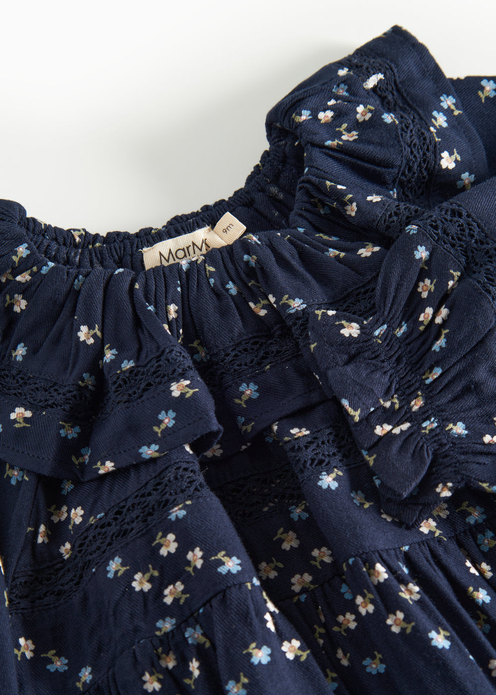 Mørkeblå blomstermønstret heldragt til baby med lange ærmer