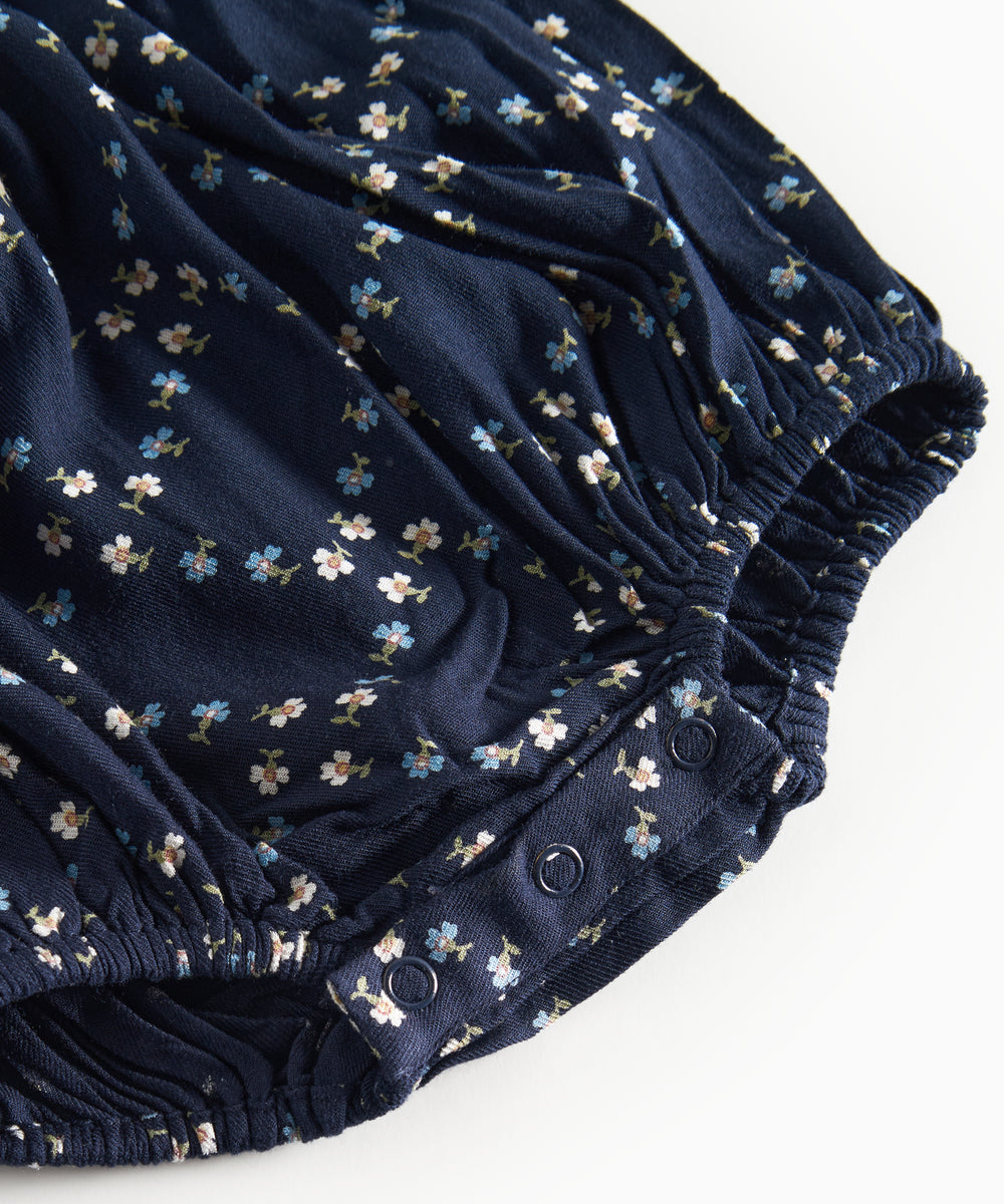 Mørkeblå blomstermønstret heldragt til baby med lange ærmer