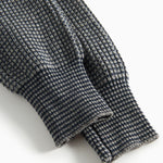 Mørkegrå strikkede babybukser med elastisk talje og ribkanter