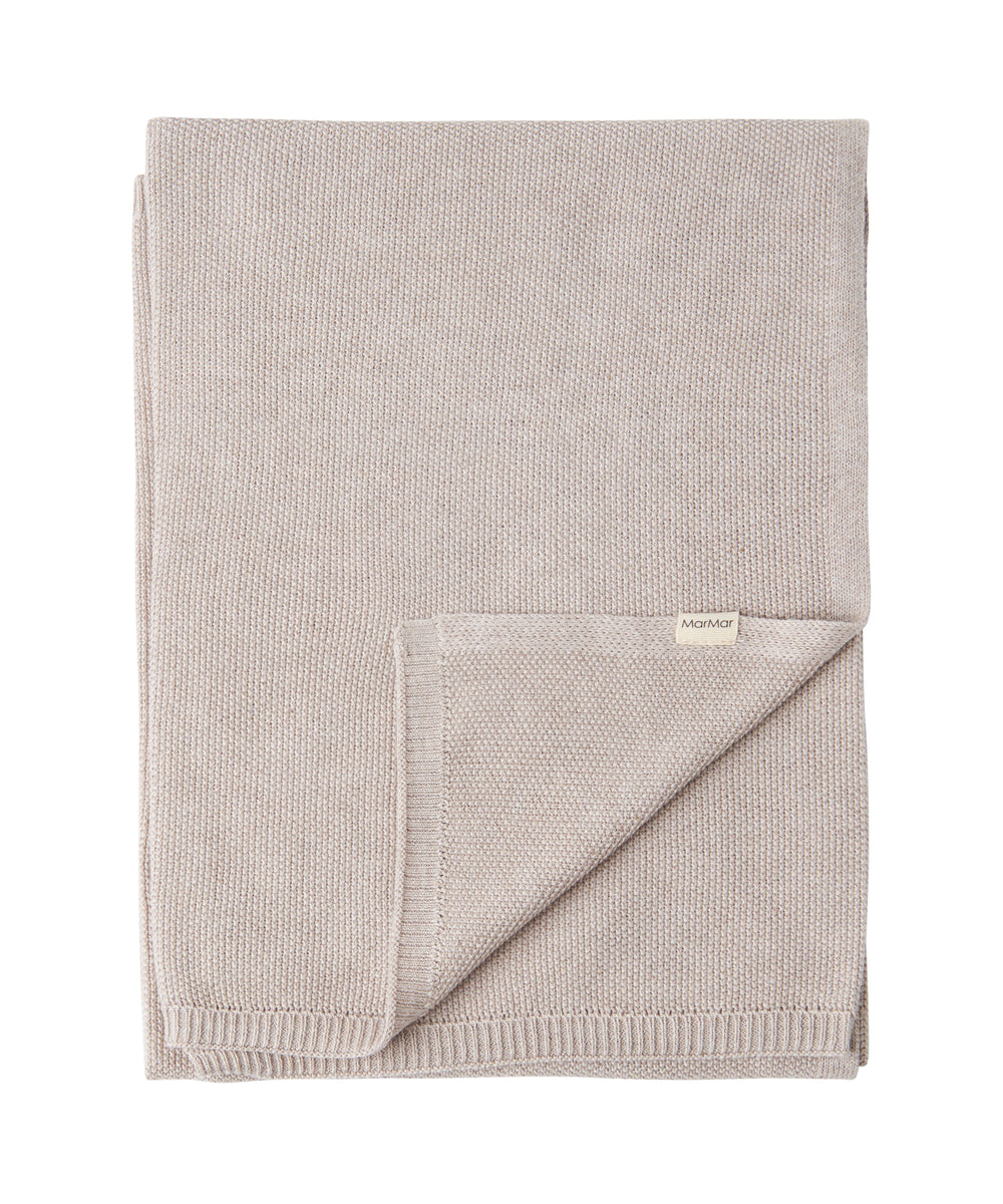 Beige strikket babytæppe