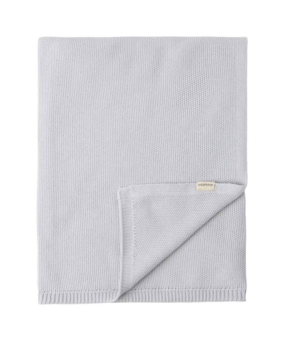 Grå strikket babytæppe