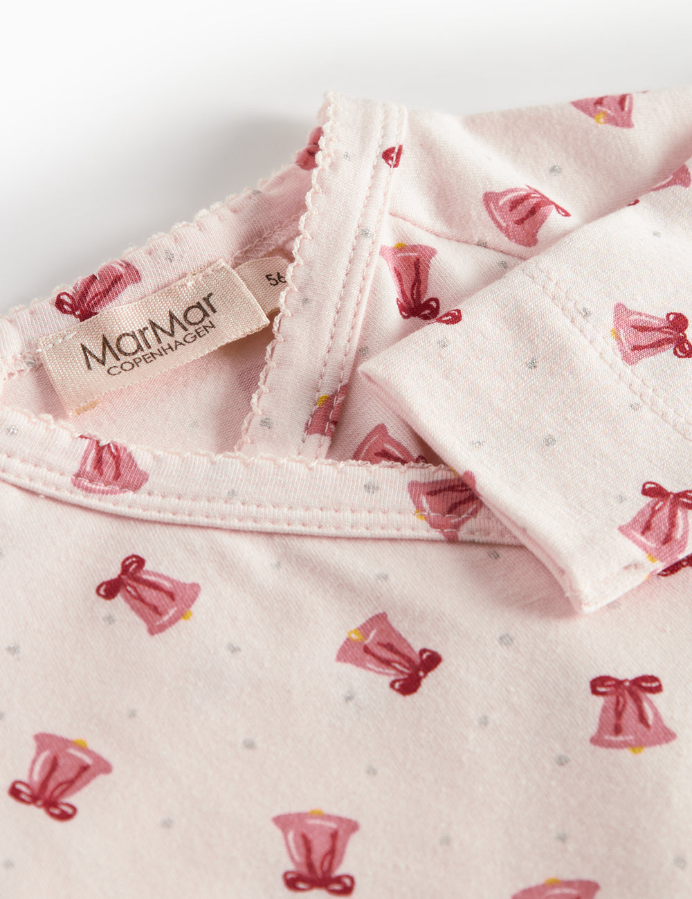 Baby jumpsuit with wrap closure and Christmas bell pattern