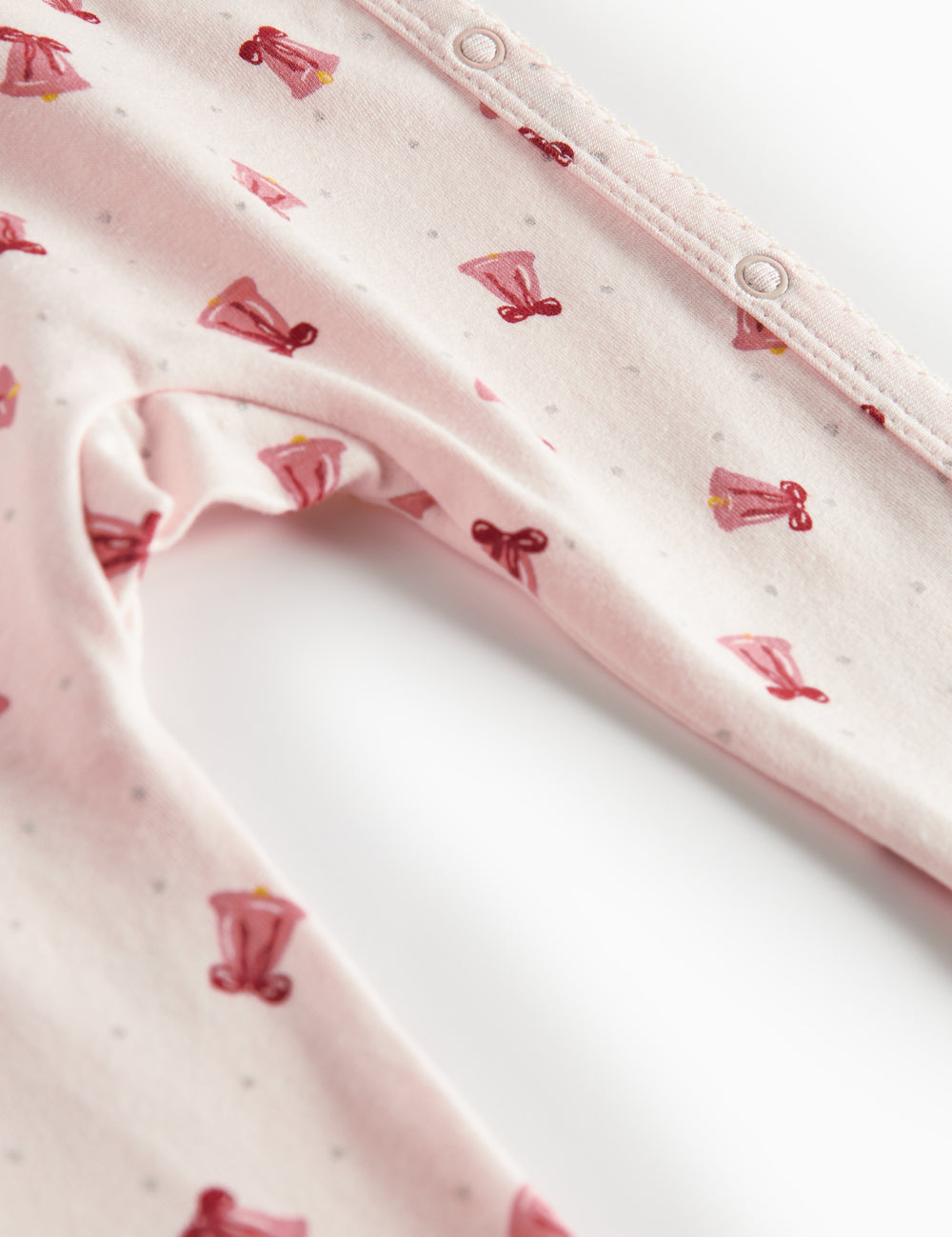 Baby jumpsuit with wrap closure and Christmas bell pattern