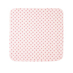 Cremefarvet babytæppe med røde juleklokker