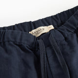 Mørkeblå bukser med elastisk talje og bindebånd i blødt stof til baby