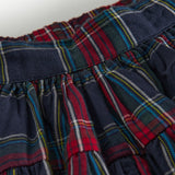 Mørkeblåt grønt og rødt ternet julenederdel med elastisk talje til børn