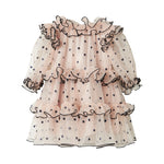 Lyserød julekjole i tyl med sorte prikker og flæser til baby