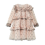 Lys beige langærmet festkjole i tyl med sorte prikker og flæsedetaljer til børn