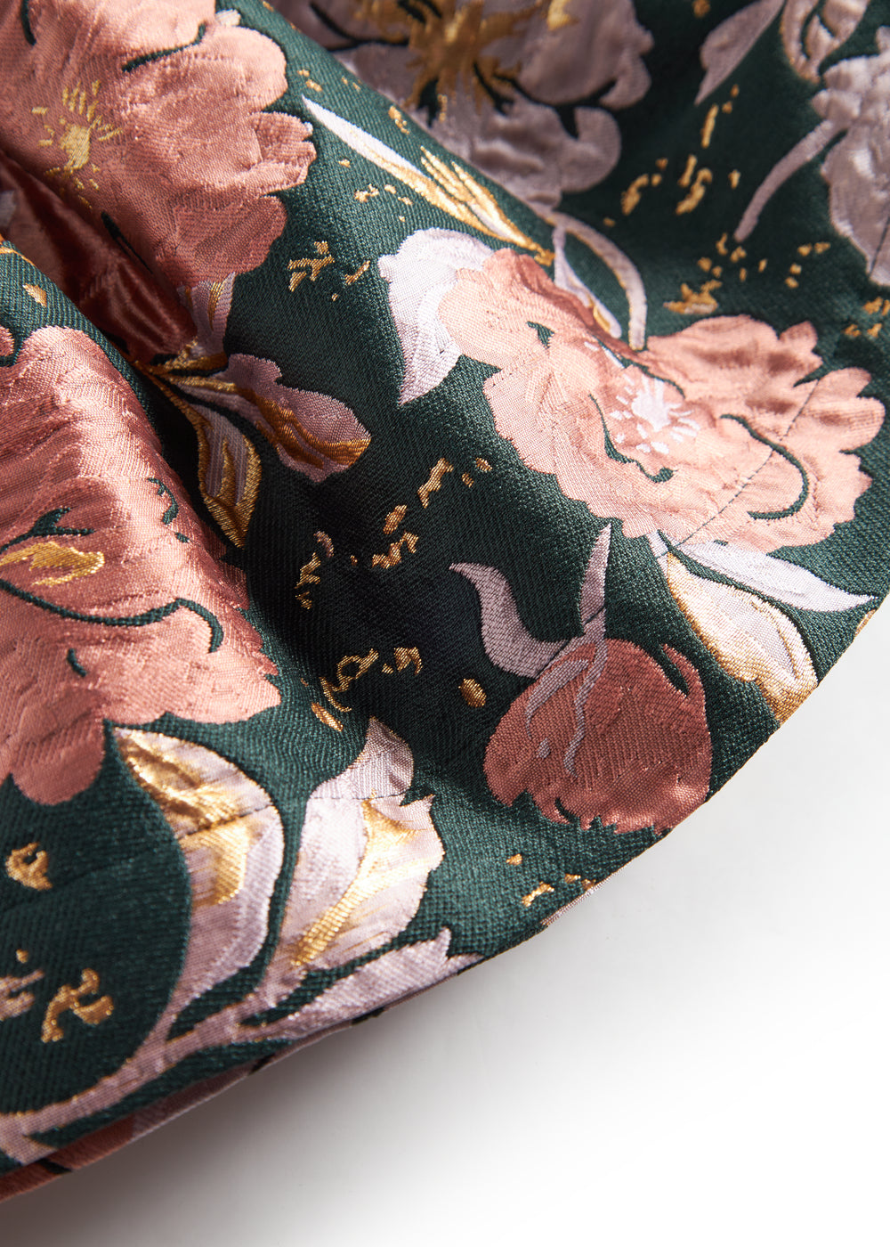 Kort mørkegrøn nederdel med store blomster og sløjfedetalje til børn