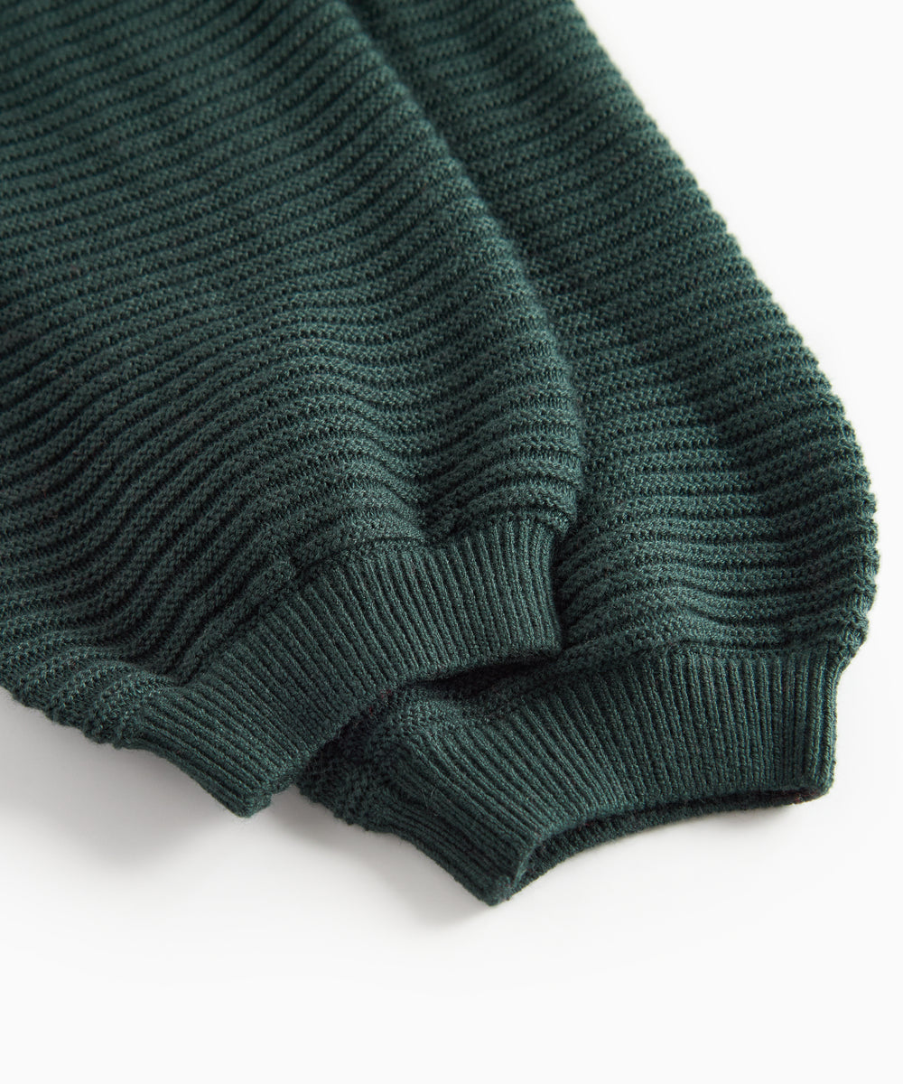 Mørkegrønne strikkede bukser med seler og fine knapper til baby