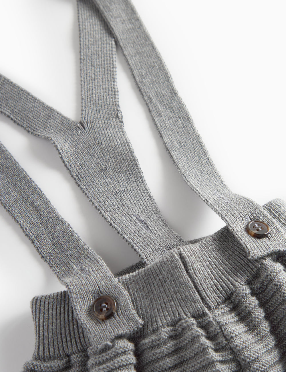 Gray knitted pants with suspenders and pretty buttons for baby