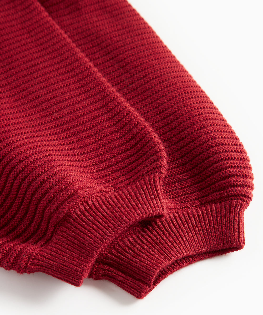 Røde strikkede bukser med seler og fine knapper til baby