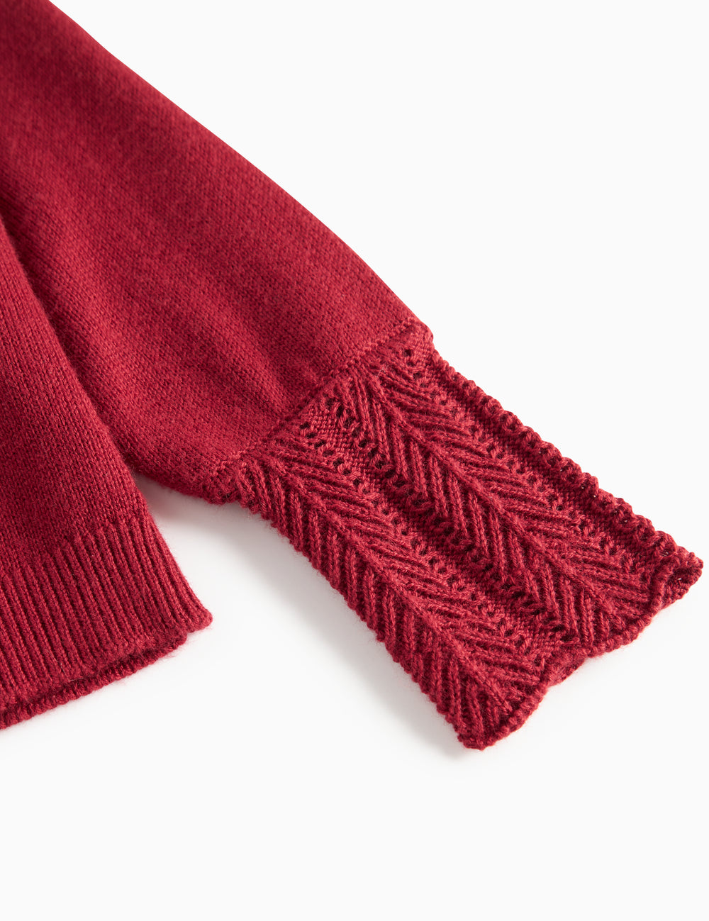 Red cardigan with fine lace patterns and ribbed edges for baby