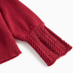 Rød cardigan med fine hulmønstre og ribkanter til baby